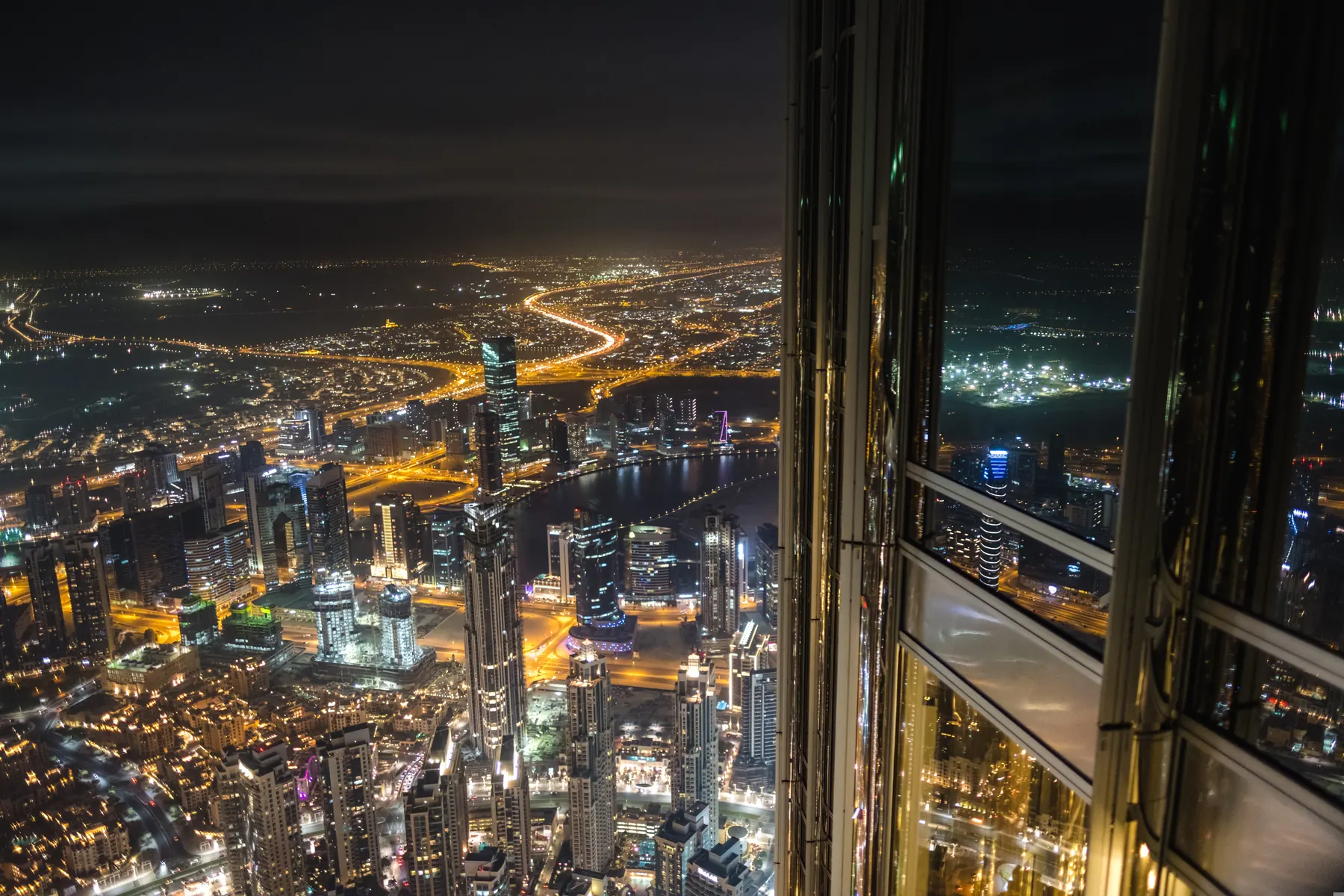 Aerial view of Dubai lit up at night