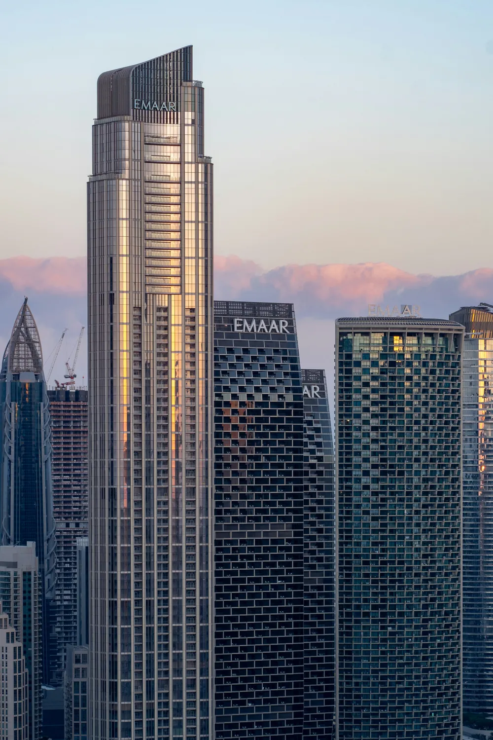 Downtown Dubai towers at sunset, including Emaar developments