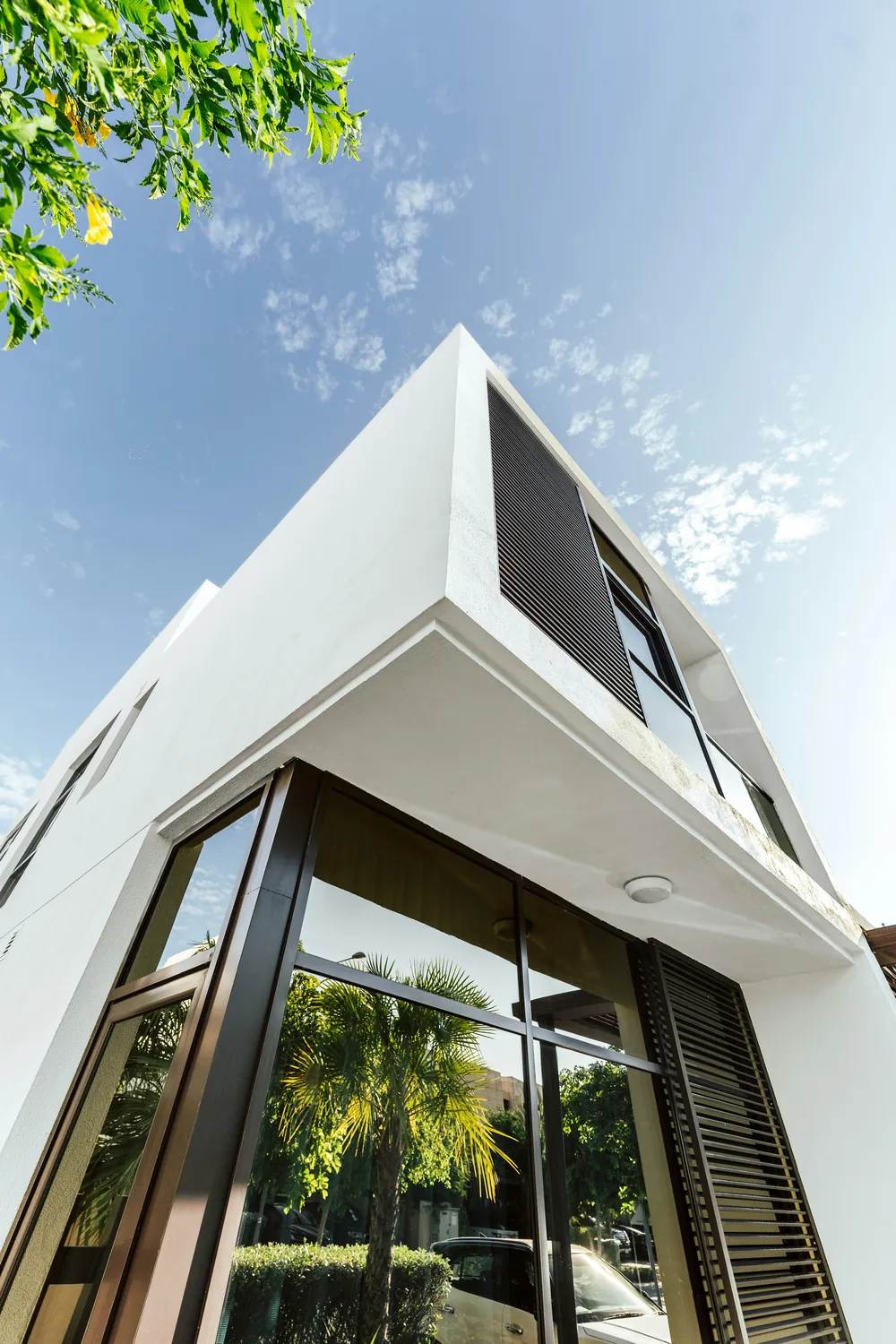 A modern villa with clean lines and full-height glass